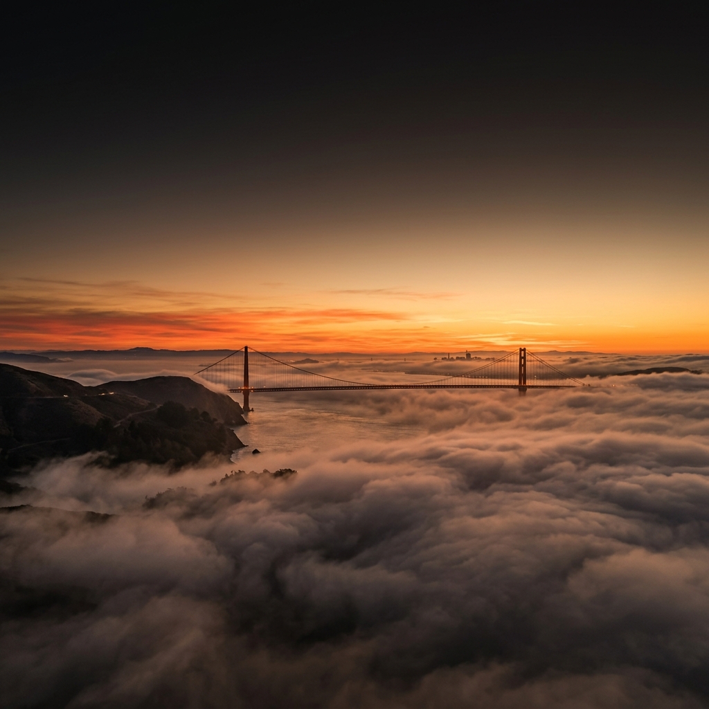 Golden Gate Bridge in fog at sunset